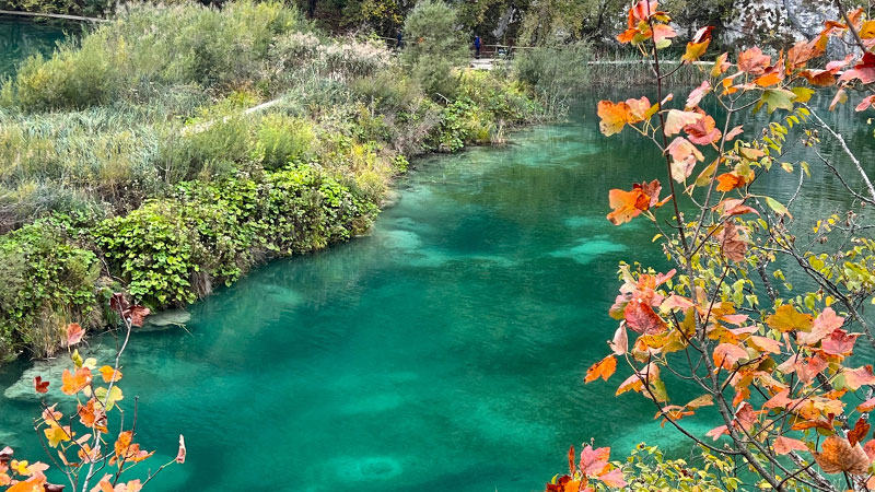 Fall foliage and an emerald lake of Plitvice Lakes National Park